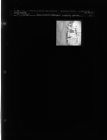Gas station attendant sweeping ground (1 Negative) (July 31, 1963) [Sleeve 67, Folder b, Box 30]